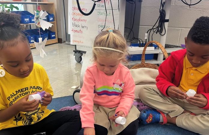  students working on candles